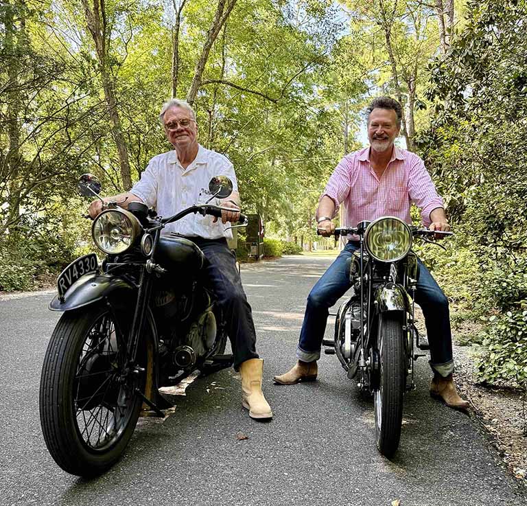 Two men riding motorcycles